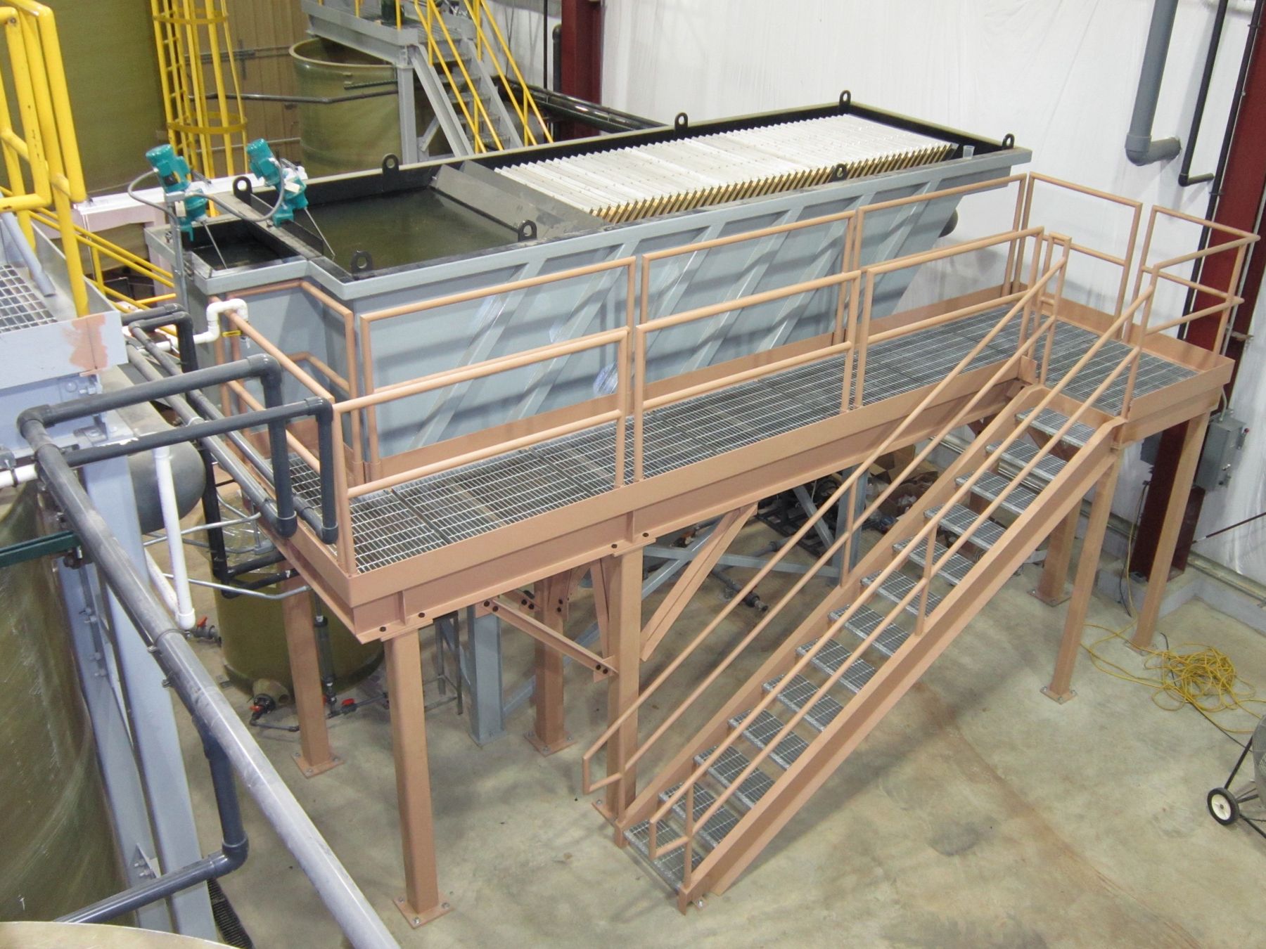 Clarifier with access platform installed indoors