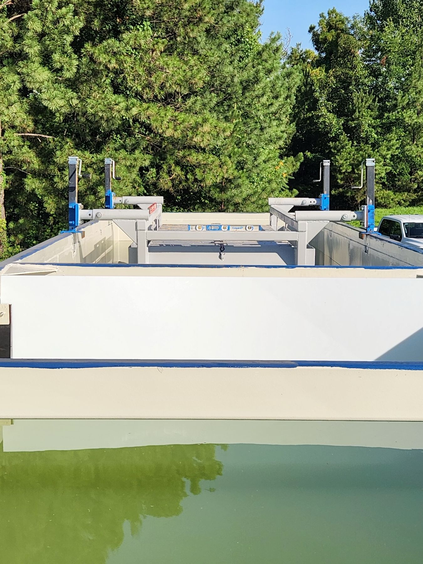 Drop-In clarifier leveled on adjustable jacks inside a tank